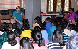Prof. Shashidhara answering questions from children during their interaction